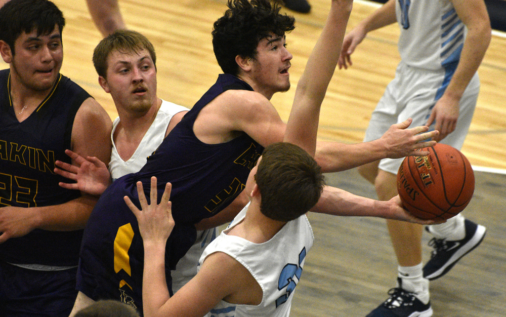 Hunter Davis splits the defense on his way to scoring two of his game-high 29 points at Scott City.