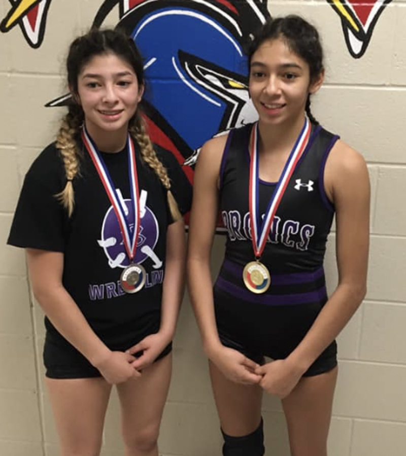 Isabell Ortiz (left) finished second and Josiah Ortiz first at a meet in Wichita last Saturday. The girls will be in McPherson this weekend for regionals. 